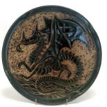 John Egerton Art studio pottery dish decorated with a dragon & has 4 lobes around the edge - 29cm