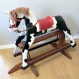 Peter the Piebald rocking horse on mahogany base with vinyl saddle and replacement main and tail,