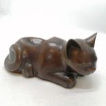 Oriental ? bronze cast cat with dished out detail to back - 28cm across