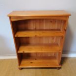 Pine bookcase. 76cm wide x 27cm deep x 96cm high. In good condition