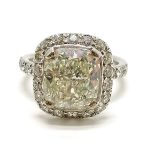 Impressive large 4.55ct centre stone cushion shaped diamond ring with 18 diamonds surrounding the