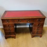Vintage Mahogany twin pedestal desk with tooled red leather insert to the top and two original keys.