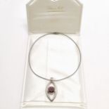 Catherine Best large silver pendant set with a red stone on a silver Tonda pendant chain in the