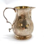 Antique silver cream jug with engraved decoration and sparrow beak spout and lemon gilt interior -