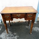 Antique Oak lowboy with 3 x drawers and pad feet. Some loses to the skirt detailing to the front,