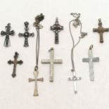 9 x silver crosses (2 on silver marked chains - longest 44cm) - largest cross (4.5cm) is unmarked