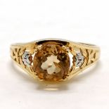 9ct hallmarked gold high set citrine with white gold roses on the shoulders - size T½ & 3.6g total