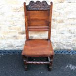 Antique Oak hall chair with carved floral detailing to the back panel with peg joints 104cm high x