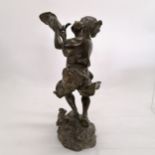 Oriental bronze sculpture of a man with a conch shell with rock and wave detail to base. 29cm high