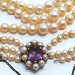 3 strand pearl necklace with a 9ct marked gold clasp set with pearls & amethyst - 40cm long & 1