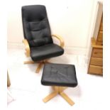 Black leather reclining chair and stool. 102cm high x 43cm deep x 76cm wide. In good used condition