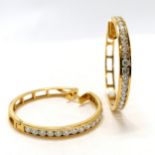 Pair of unmarked yellow gold (touch tests as 18ct or higher) hoop earrings channel set with 18