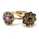 2 x 9ct marked gold flower rings - 1 amethyst / pearl (size N) the other garnet / white stone (