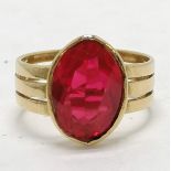 Unmarked 18ct gold (touch tests as) ring set with red stone, - size R & 6.2g total weight ~