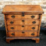 Antique flame Mahogany Bachelors 4 drawer chest on bracket feet with fold over top. Maximum width