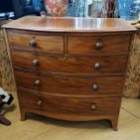 Mahogany bow front two over three chest of drawers. 104cm x 55cm x 104cm high. Some fading,