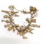 9ct hallmarked gold charm bracelet complete with charms (shark, flintlock pistol, teddy bear