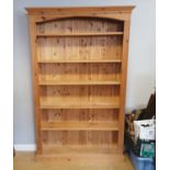 Tall pine bookcase with fluted detail. 114cm wide x 25cm deep x 194cm high. In good used condition.