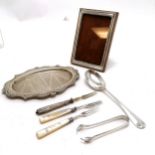 Silver wooden backed picture frame (14cm x 10cm) t/w silver spoon, tongs, 2 silver pronged mother of