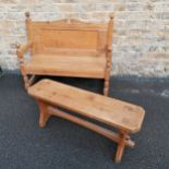 Antique pine hall seat with carved scroll and leaf detail to the back. 116cm wide x 46cm deep x 98cm