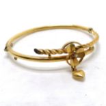 Antique gilt metal bangle with 3 leaf clover / heart detail set with a pearl -
