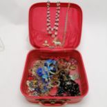 Qty of costume jewellery in a red leather case inc horse brooches, loose hand carved cameo etc