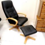 Black leather reclining chair and stool. 102cm high x 43cm deep x 76cm wide. In good used condition