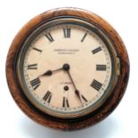 Antique oak cased wall clock retailed by Camerer Cuss & Co. London. Has key but no pendulum. 26cm
