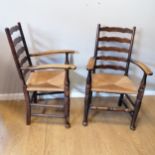 Pair of antique oak ladder back armchairs with rush seats in overall good used condition. 100cm high