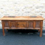 Large panelled oak coffer / storage chest made up of antique carved panels including linen fold to