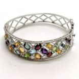 Silver multi stone set bangle - 6.5cm across & 26g