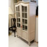 Painted 2 door glazed display cabinet with shelved interior and original key. 183cm high x 103cm
