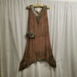 1920s silk beaded flapper dress. Silk, is in good overall condition, some losses to the bead work.