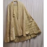 Edwardian silk cape with quilted trim, silk tassels around neck. Has a mark as photographed