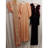 3 1940s long dresses. Black crepe with red trim and long sleeves in good condition, chest 76cm. Pink