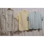 3 1950s blouses. 1 is all white lace in good condition, 2nd is blue cotton floral pattern on front