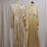 2 1940s wedding dresses, 1 is a cream satin dress with pearl trim, slight staining to hem. Chest