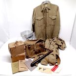 1943 dated British military bag, 3 khaki shirts (a/f), 2 gas masks, wooden truncheon, booklets, mess
