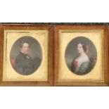 A pair of framed cabinet oval Portraits, oil on card, a Gentleman and lady, the lady wearing a