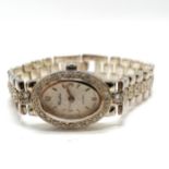 Ladies sterling silver white stone set quartz Woodford wristwatch - 44g total weight & in worn