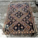 Antique kilim rug, 135cm x 220cm- has fading and wear.