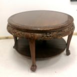 Oriental carved circular hardwood low table, 84cm diameter x 56cm high. In overall good used