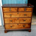 A regency straight front chest of two short over three graduated long drawers on shaped bracket