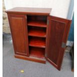 A Victorian Mahogany two panel door floor standing cupboard open to reveal four shelves within. 42.