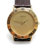 Gucci gents gold plated quartz watch (32mm case) - has marks to case & glass - WE CANNOT GUARANTEE