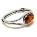 Unmarked silver and amber bangle - 32.8g total weight & 7cm across