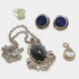 Stone set (hawks eye?) silver pendant by Stephen Cooper on a silver 44cm chain, pale blue pear
