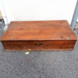 A matched pair of vintage stained pine under bed storage boxes with brass casters and hinged tops,