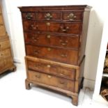 Antique walnut low chest on chest in Queen Anne style. Top section of three short drawers over two