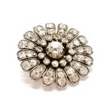 Antique diamond set flower design brooch - 12.5g total weight & approx 28mm across & contains 61